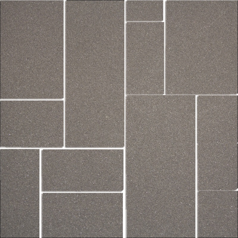 Ohebný kamenný obklad čistě šedé barvy připomínající lesklý světlý beton.