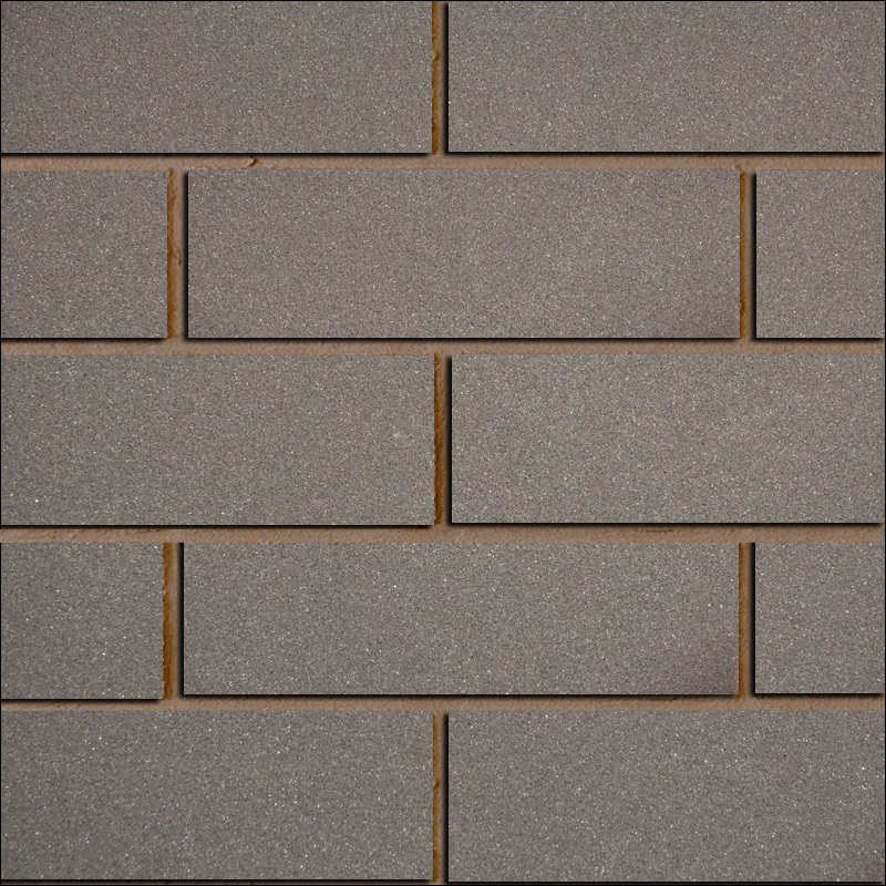 Ohebný kamenný obklad čistě šedé barvy připomínající lesklý světlý beton.