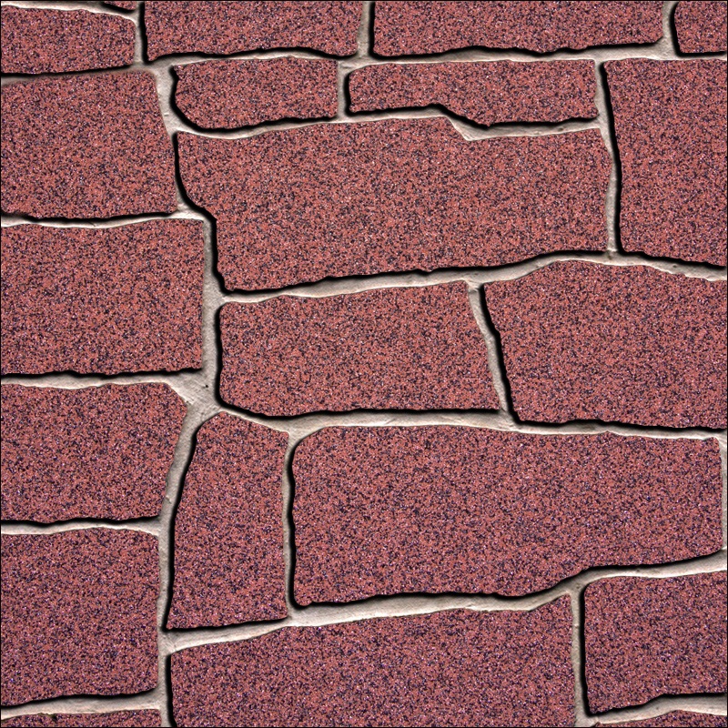 Ohebný kamenný obklad tmavě červené barvy se zrnky černé barvy připomínající mozaiku