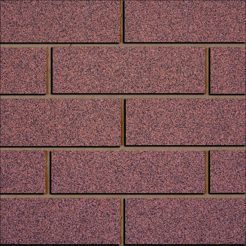 Ohebný kamenný obklad tmavě červené barvy se zrnky černé barvy připomínající mozaiku